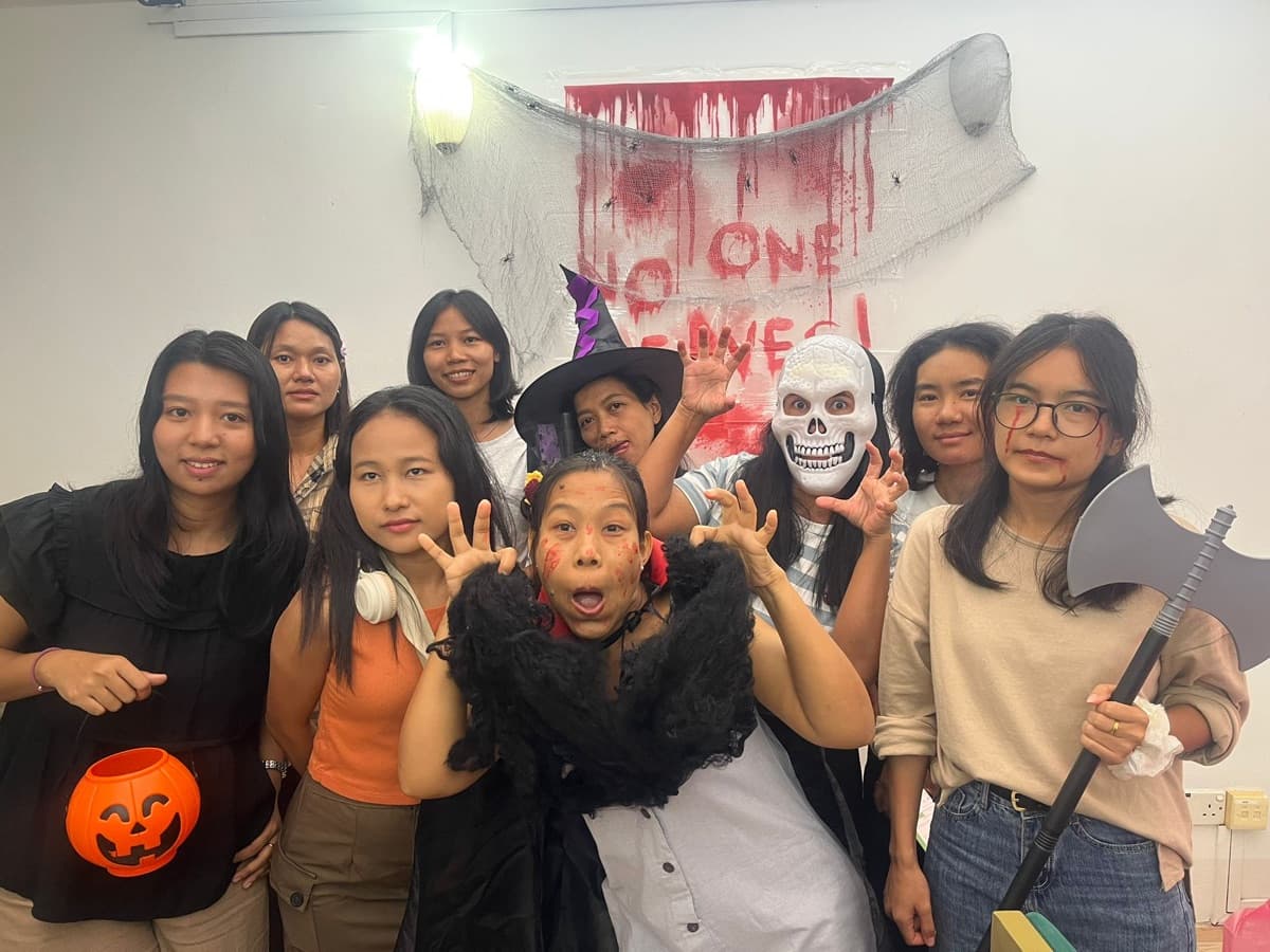 Helpers in costume at the Halloween party