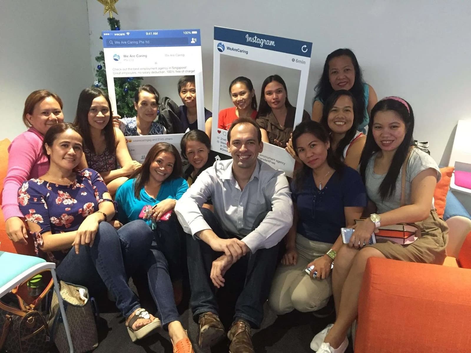 David Bensadon in 2016, surrounded by smiling helpers