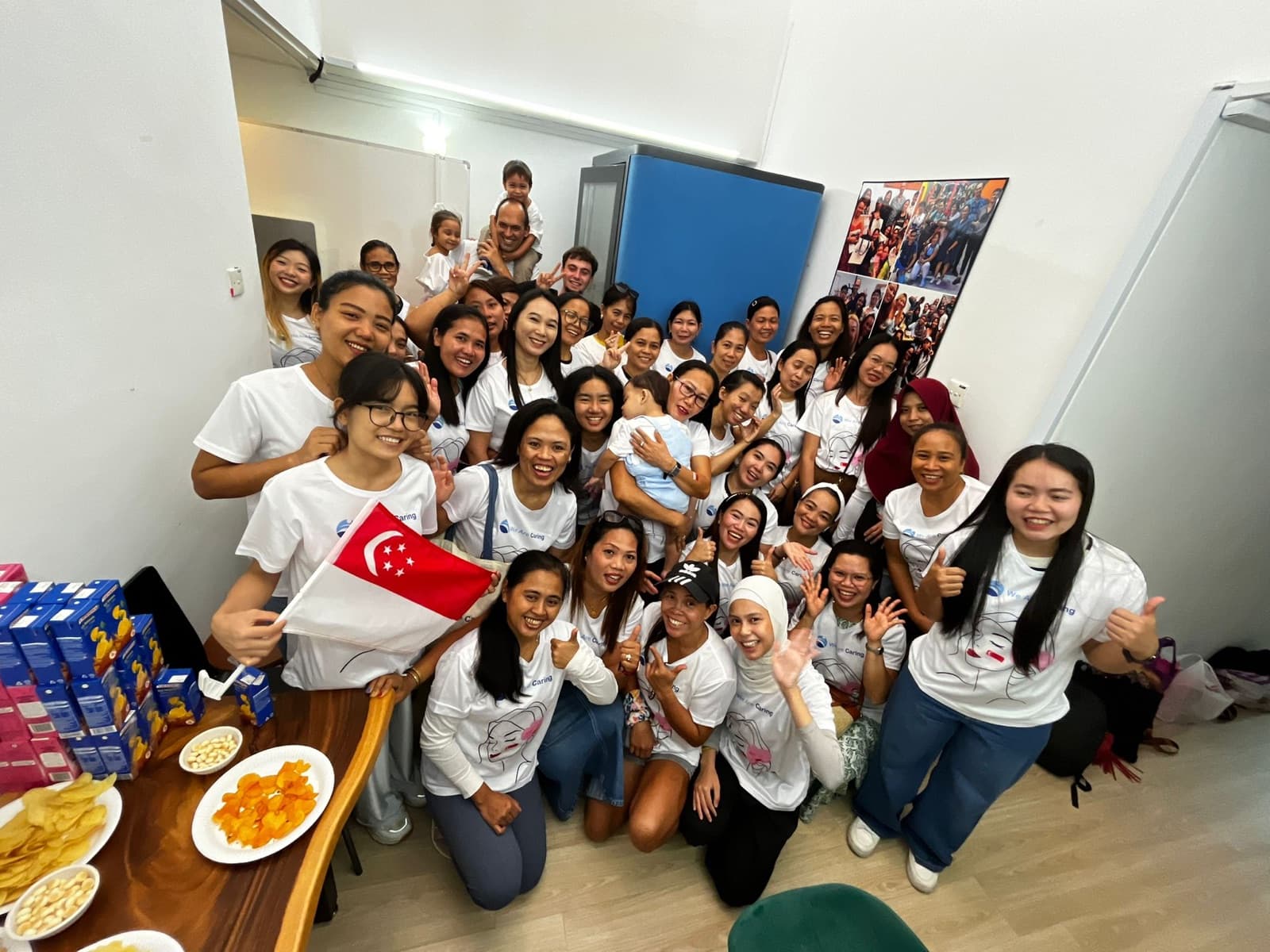 Helpers celebrating National Day together at the We Are Caring office