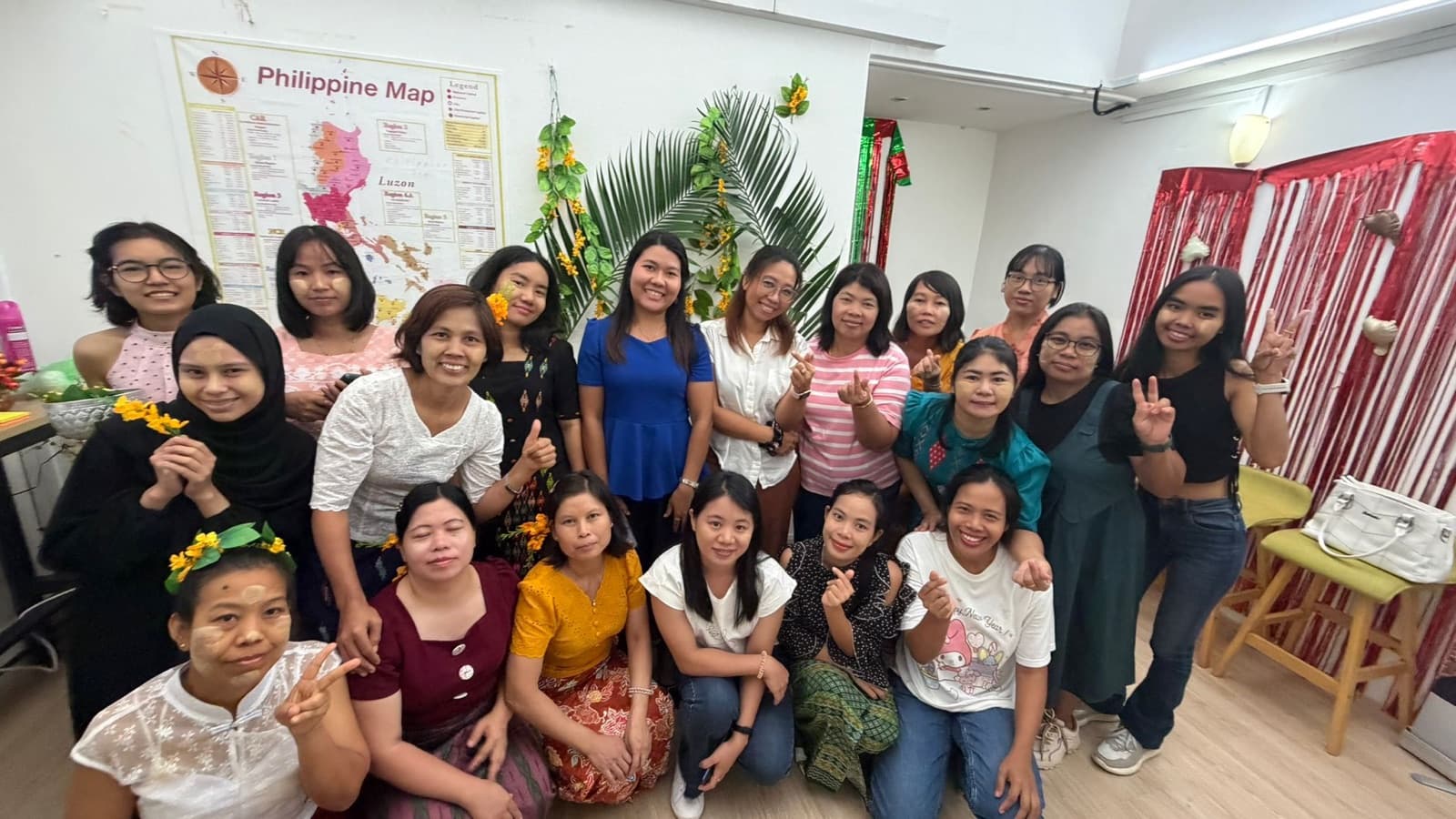 Helpers in traditional dress at a community celebration in the office